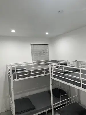 a room with two bunk beds in a room at Modern Hostel address changed in Los Angeles