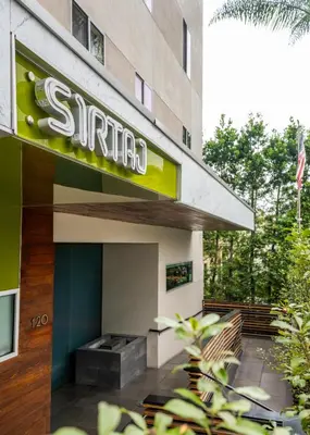 a sign for the entrance to a hotel at SIRTAJ – Beverly Hills in Los Angeles