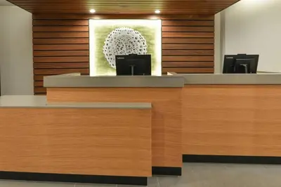 a reception desk in a hospital with a picture on the wall at Fairfield Inn & Suites by Marriott Moorpark Ventura County in Moorpark