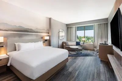 a hotel room with a bed and a television at Courtyard by Marriott Los Angeles Monterey Park in Monterey Park