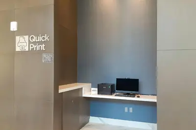 an office with a desk with a computer on it at Courtyard by Marriott Los Angeles Monterey Park in Monterey Park