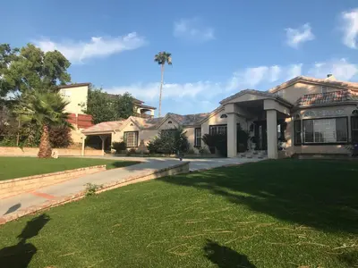 a house with a lawn in front of it at paradise luxury experience in Woodland Hills