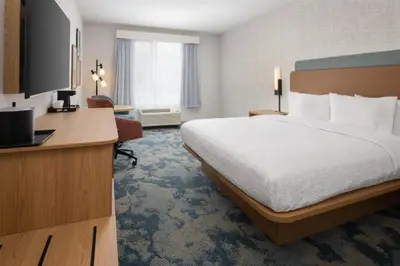 a hotel room with a bed and a desk at Hampton Inn by Hilton North Hollywood in North Hollywood