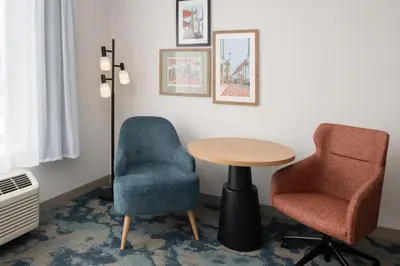 a room with two chairs and a table at Hampton Inn by Hilton North Hollywood in North Hollywood