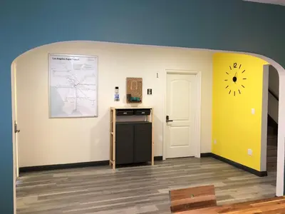 a kitchen with a stove and a clock on the wall at 8th and Ardmore in Los Angeles