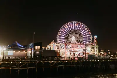 a ferris wheel on a pier at night at 8th and Ardmore in Los Angeles