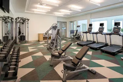 a gym with treadmills and ellipticals in a room at Element Ontario Rancho Cucamonga in Ontario