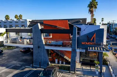 a large building with a sign for a mountain institution at The Moment Hotel in Los Angeles