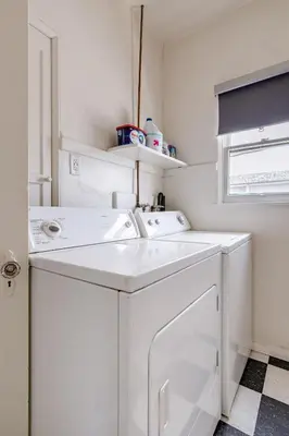 a white washer and dryer in a small room at Visit the Beach from a Historic Downtown Apartment - NRP21-00092 in Long Beach