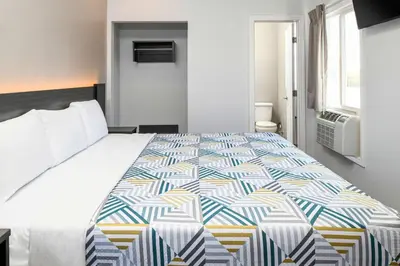 a bedroom with a large bed in a room at Motel 6 San Pedro, CA Port of Los Angeles in San Pedro