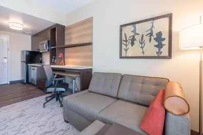 a living room with a couch and a desk at TownePlace Suites by Marriott Thousand Oaks Agoura Hills in Agoura Hills