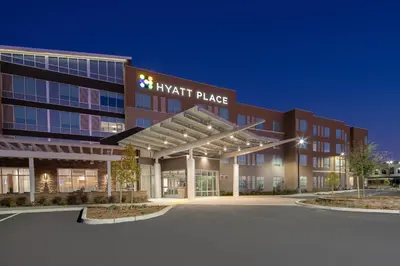 an office building with a k audit palace sign on it at Hyatt Place Bakersfield in Bakersfield