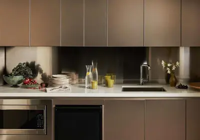 a kitchen with a sink and a microwave at L'Ermitage Beverly Hills in Los Angeles