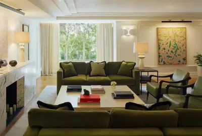 a living room with a couch and a table at L'Ermitage Beverly Hills in Los Angeles