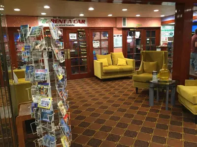 a store with couches and chairs in a room at Tradewinds Airport Hotel in Inglewood