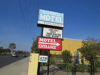 a sign for a motel on the side of a street at Calico Motel in Anaheim