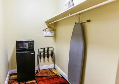 a room with a skateboard hanging on the wall at Vagabond Inn Long Beach in Long Beach