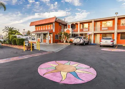 a parking lot with a sun painted on it at Aqua Venture Inn in Long Beach