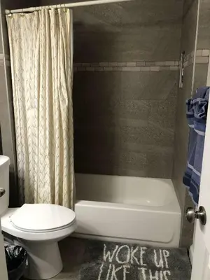 a bathroom with a toilet and a tub and a sink at Fully remodeled Beautiful house in West Covina in West Covina