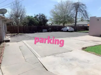 a parking lot with a pink sign on the ground at Pasadena single house 3b1b \u4e09\u623f\u4e00\u5385\u4e00\u53a8\u4e00\u6d74 in Pasadena