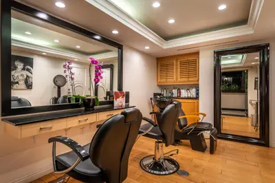 a hair salon with two chairs and a mirror at Beverly Hills Plaza Hotel & Spa in Los Angeles