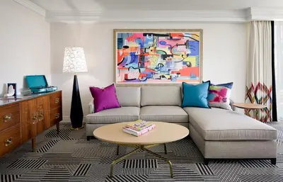 a living room with a couch and a table at Le Parc at Melrose in Los Angeles