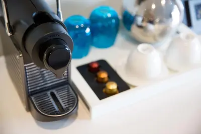 a coffee maker sitting on top of a counter at Mosaic Hotel Beverly Hills in Los Angeles