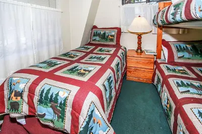 a bedroom with two twin beds and a lamp at Breezy Estate-114 by Big Bear Vacations in Big Bear Lake