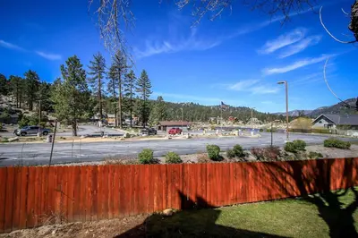 a view of a parking lot with a fence at Boulder Creek -1417 by Big Bear Vacations in Big Bear Lake