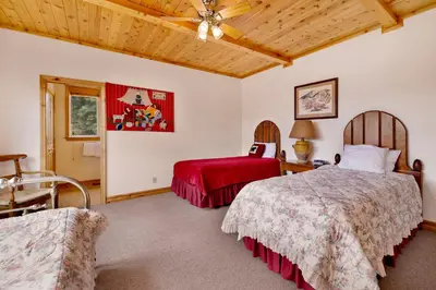 a bedroom with two beds and a ceiling at Starlight Vistas-1524 by Big Bear Vacations in Big Bear Lake