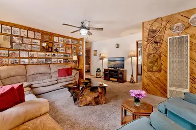 a living room with a couch and a table at Popko's Place Resort Chalet by Big Bear Vacations in Big Bear Lake