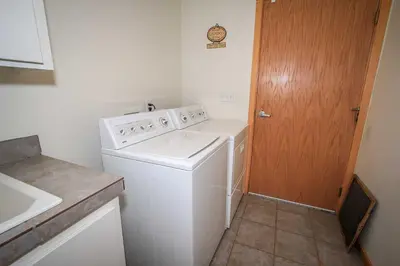 a white washer and dryer in a small kitchen at Can't Bear to Leave-1156 by Big Bear Vacations in Big Bear Lake