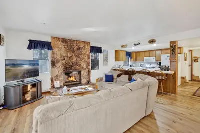 a living room with two couches and a fireplace at Ski Time Getaway-1848 by Big Bear Vacations in Big Bear Lake
