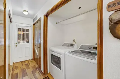 a kitchen with a washer and dryer in a room at Ski Time Getaway-1848 by Big Bear Vacations in Big Bear Lake