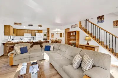 a living room with a couch and a table at Ski Time Getaway-1848 by Big Bear Vacations in Big Bear Lake