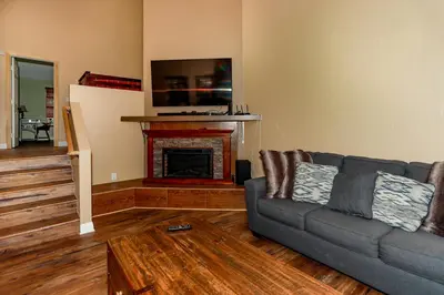 a living room with a couch and a fireplace at Fawnskin Chalet-1826 by Big Bear Vacations in Fawnskin