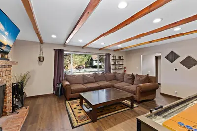 a living room with a couch and a table at Mountain Fun-1729 by Big Bear Vacations in Big Bear Lake