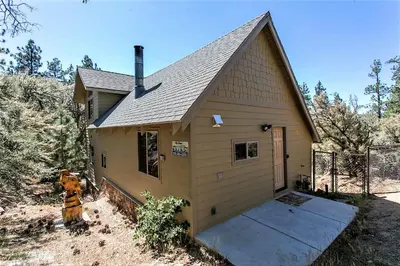 a small house with a fire hydrant in front of it at Grandpas Axe-1775 by Big Bear Vacations in Big Bear Lake