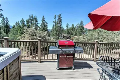 a barbecue grill sitting on a wooden deck at Grandpas Axe-1775 by Big Bear Vacations in Big Bear Lake
