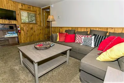 a living room with a couch and a table at Grandpas Axe-1775 by Big Bear Vacations in Big Bear Lake