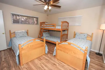 a room with two bunk beds and a ceiling at Cozy up to Summit-1651 by Big Bear Vacations in Big Bear Lake