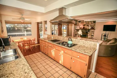 a kitchen with a sink and a counter top at Cozy up to Summit-1651 by Big Bear Vacations in Big Bear Lake