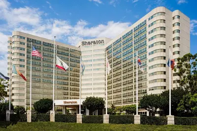 a large building with flags in front of it at Sheraton Gateway Los Angeles Hotel in Los Angeles