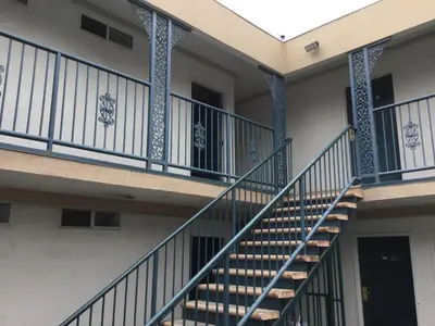 an empty building with stairs in front of it at Beverly Inn in Los Angeles