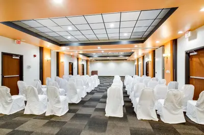 an empty room with white chairs and a whiteboard at Motel 6-Carson, CA in Carson