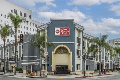 a building with a sign on the side of it at Best Western Plus Hotel at the Convention Center in Long Beach