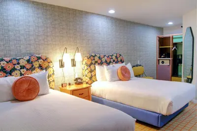 a hotel room with two beds at The Hollywood Franklin Hotel near Universal Studios in Los Angeles