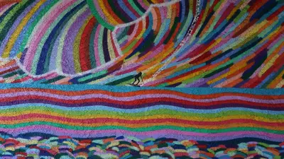 a painting of a person standing in the middle of a wave at Surf City Inn in Huntington Beach
