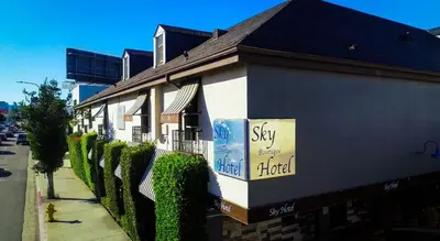 a building with a sign on the side of it at L.A. Sky Boutique Hotel in Los Angeles