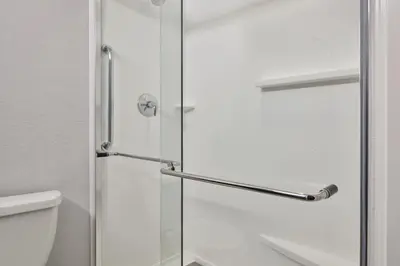 a shower with a glass door next to a toilet at Courtyard Culver City Los Angeles in Los Angeles